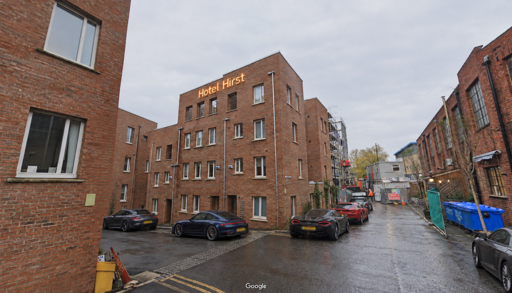 Brick building on Hume Street with a conceptual Hotel Hirst neon sign
